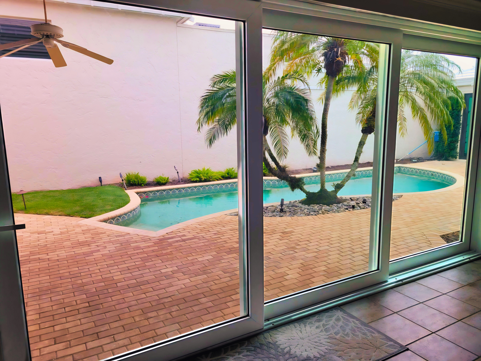 Impact multi-track sliding glass doors are chic entry options to Florida lanais or patios